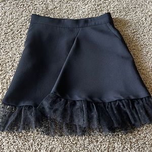 Maje mini black skirt, accented lace ruffles